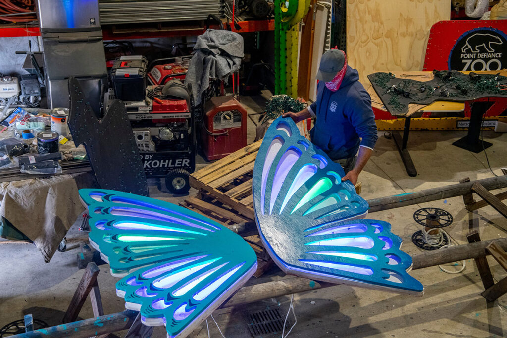 man building butterfly for zoolights